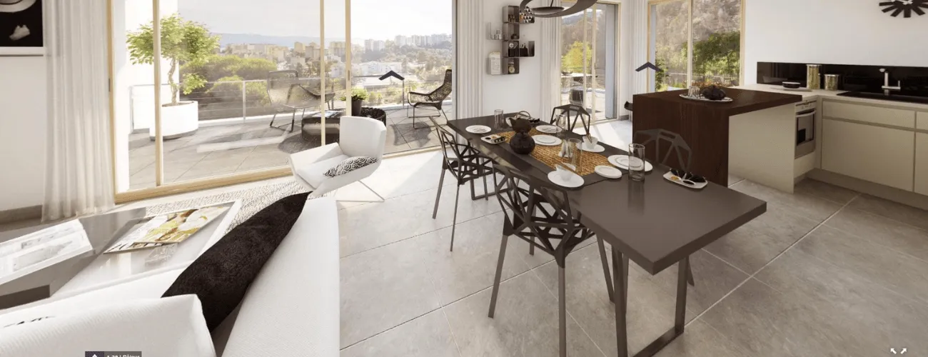 intérieur d'un salon spacieux et de sa cuisine ouverte