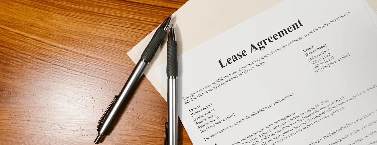 A Piece of Paper Placed on the Table with Pens to Show a Second Home Lease
