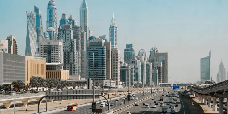 Cars on Road Near City Buildings