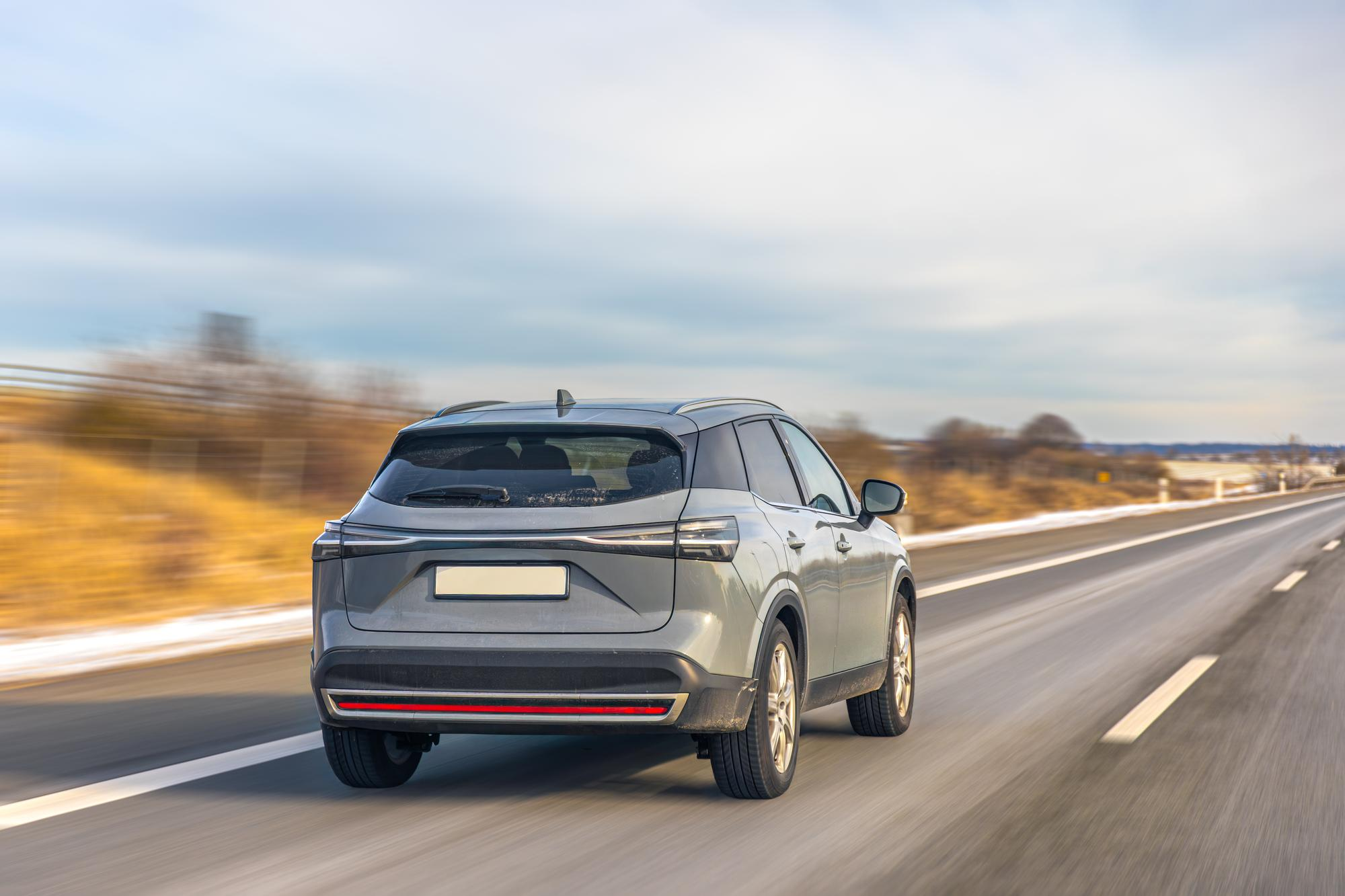 Modern crossover driving on highway