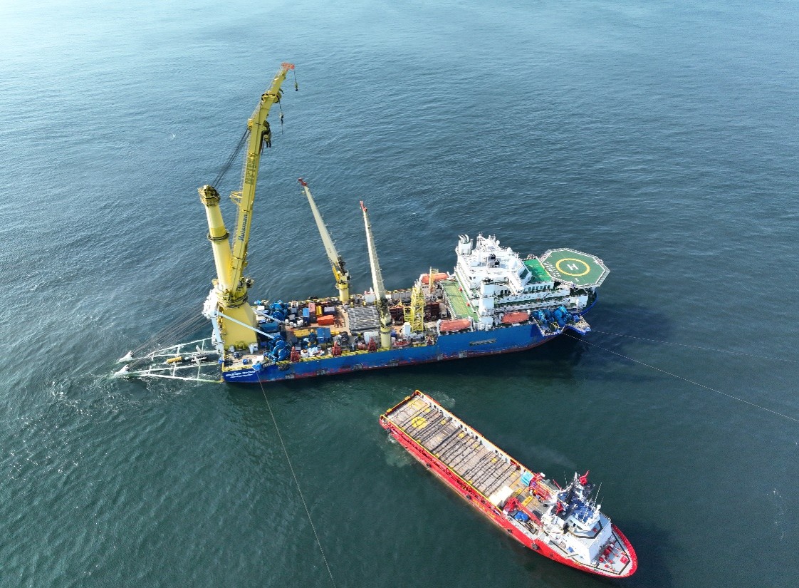Two vessels dredging