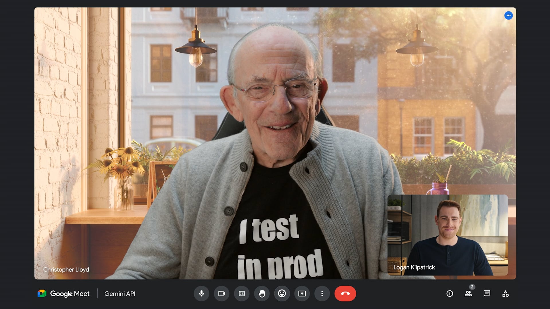 Elderly man with glasses smiling during Google Meet video call with another participant visible