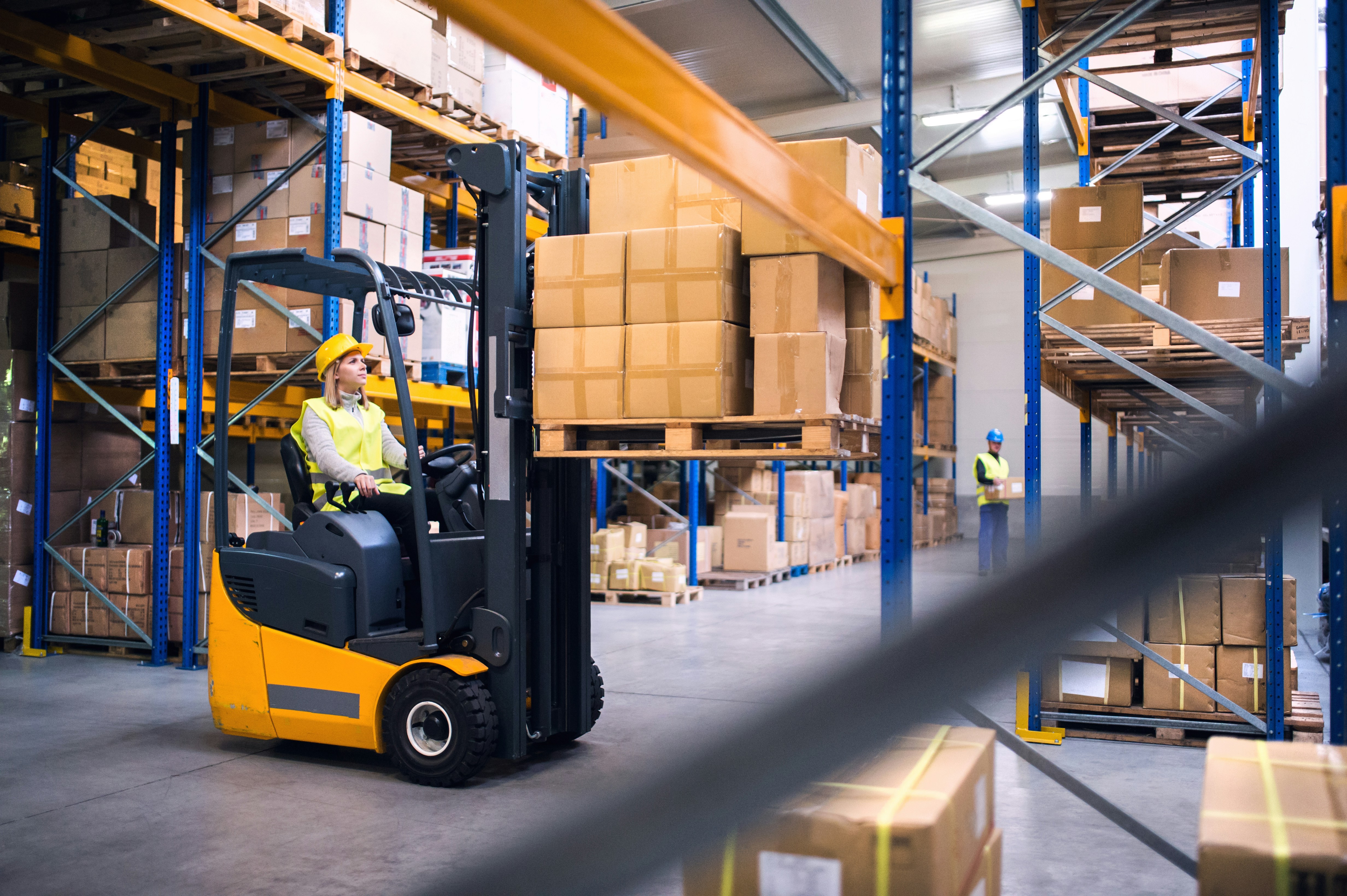 Fork lift operator in a warehouse