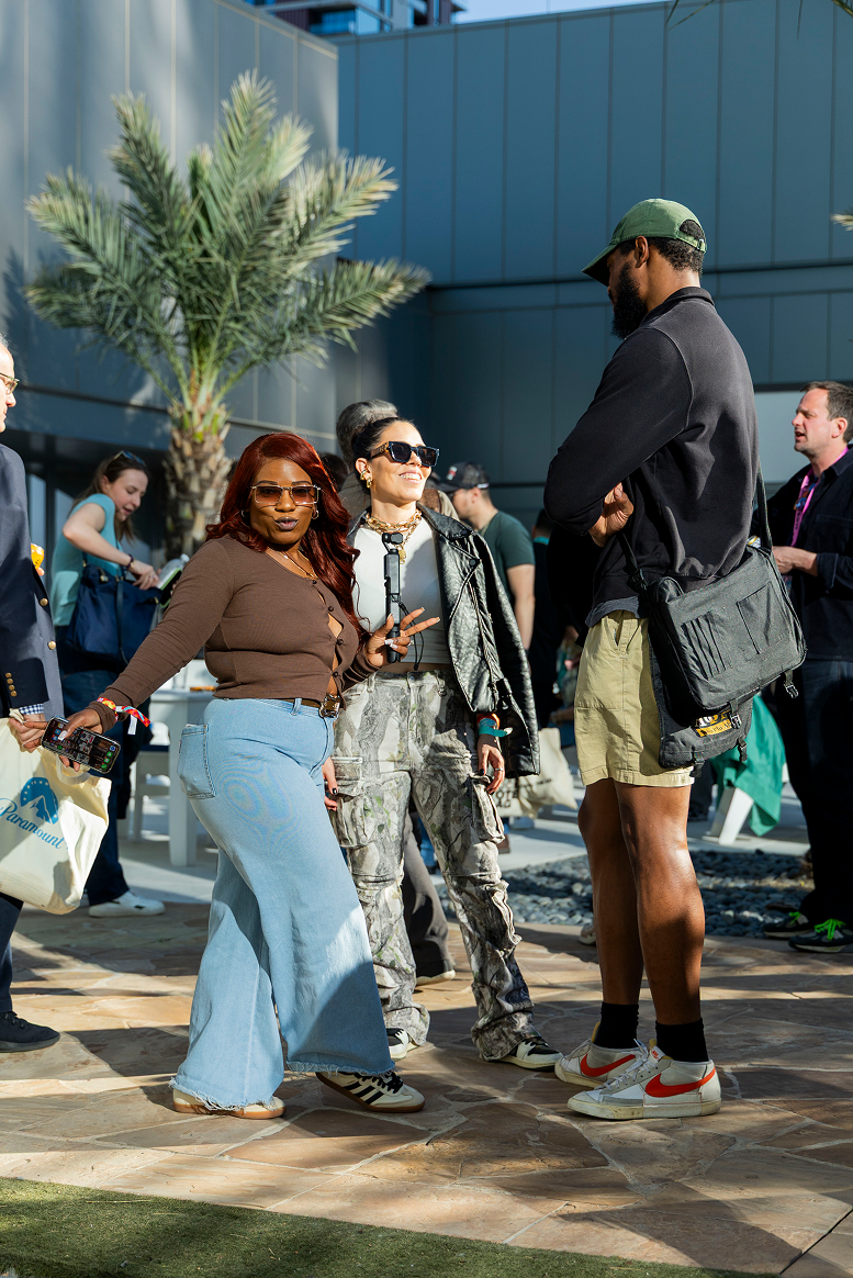 Women on stage speaking at an event