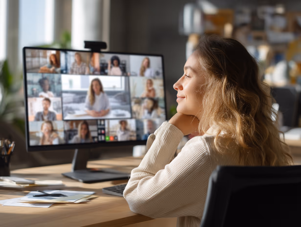 Young professional in video conference call at desk