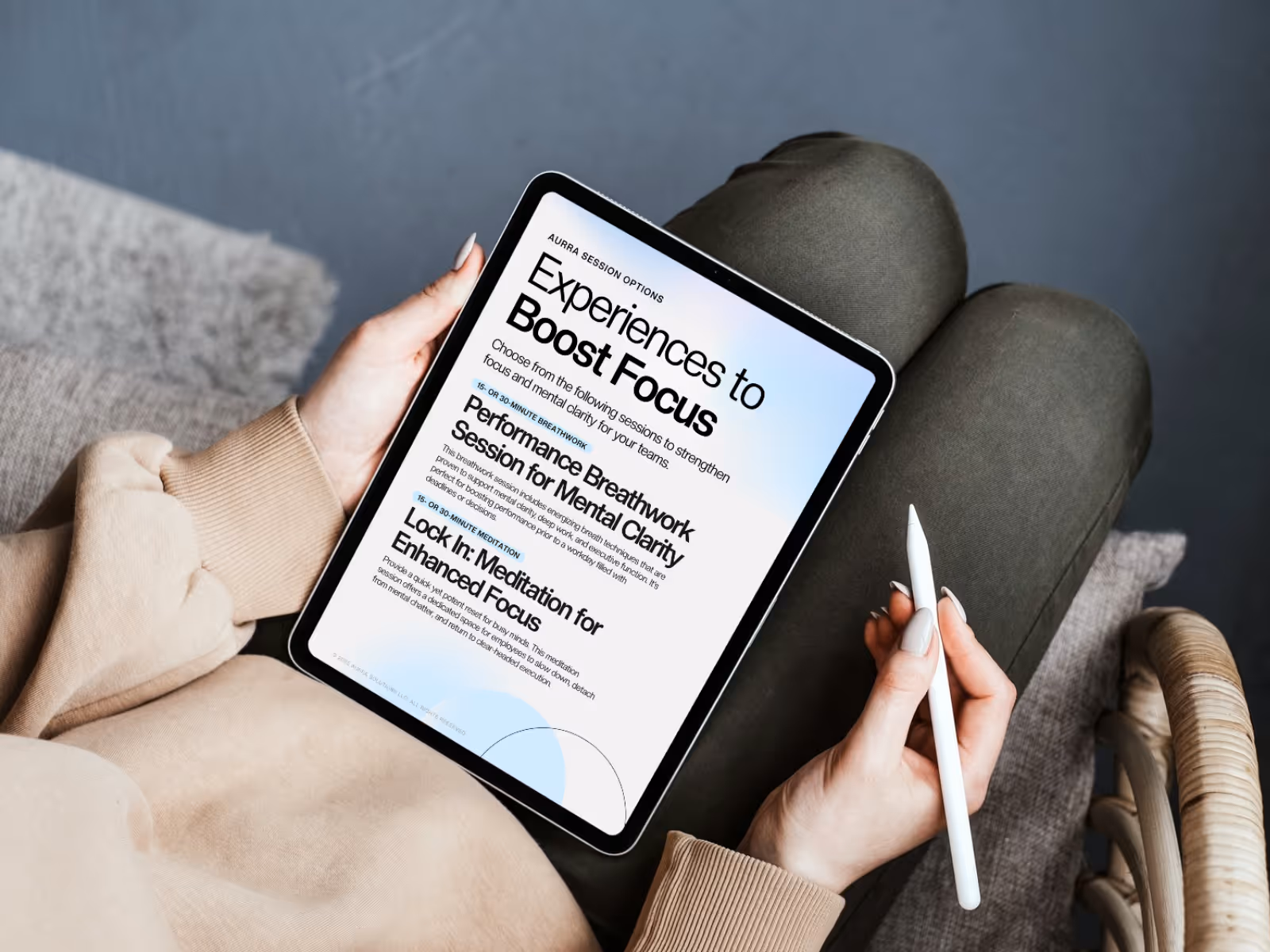 Person holding tablet with focus and productivity guide on screen