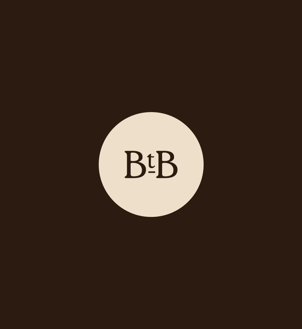 The Barn til Bords BtB symbol on a dark brown background
