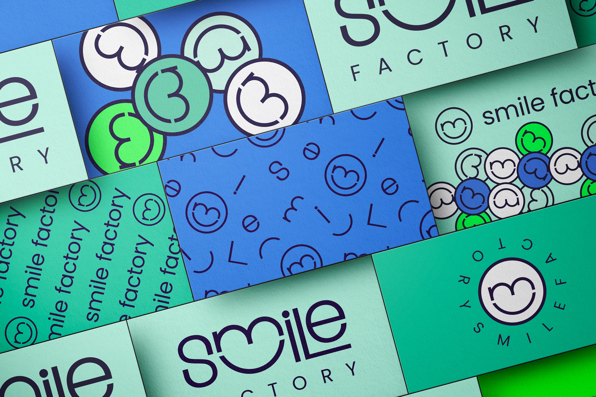 The Smile Factory logo and symbols in green and blue