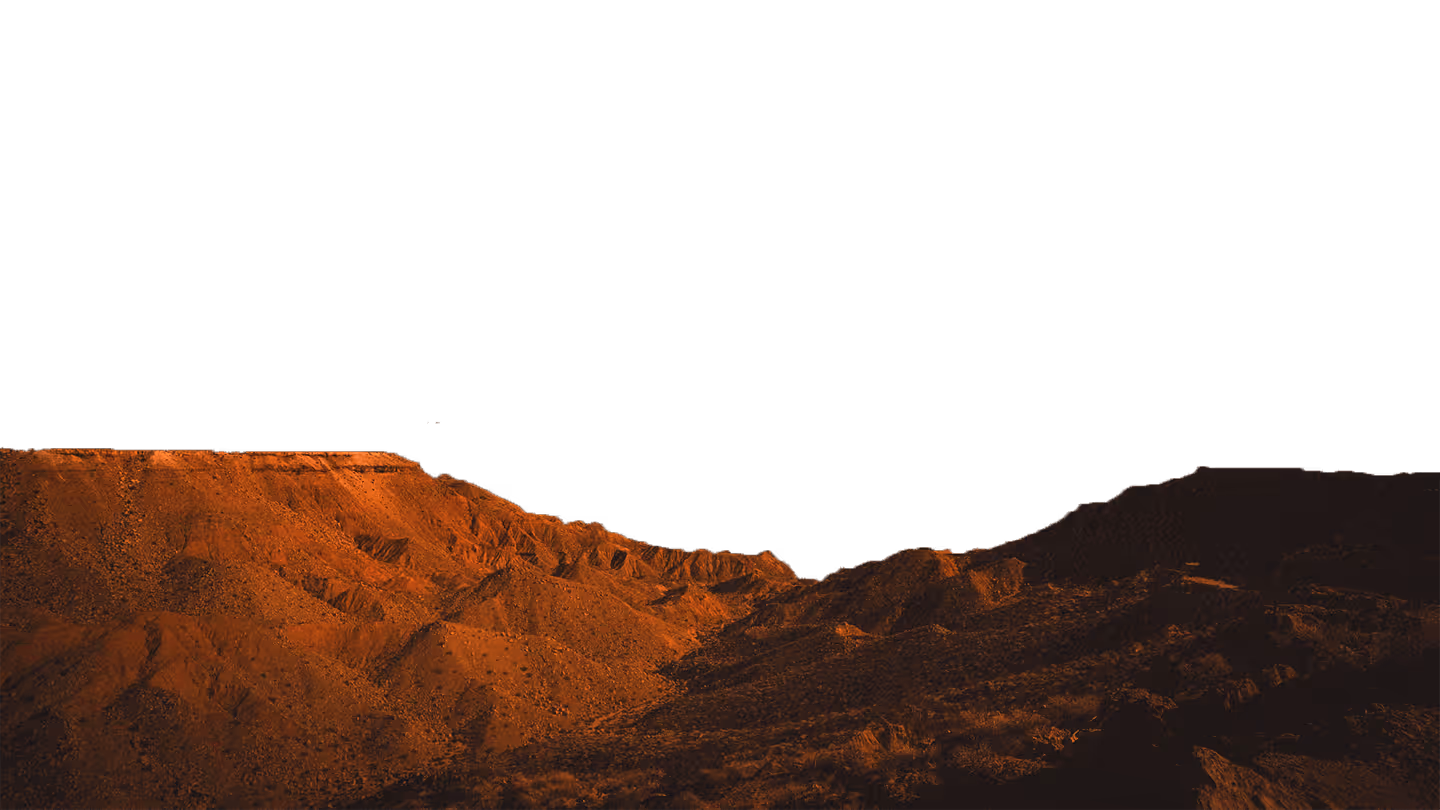 Textured red rock terrain in the foreground, resembling a Martian or desert-like landscape.