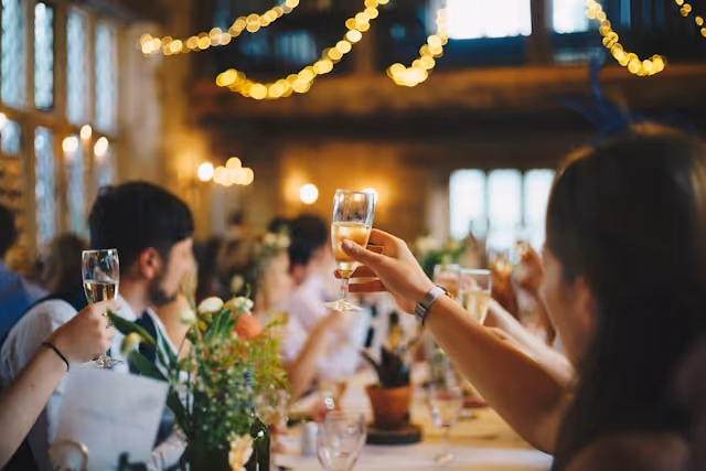 A raised glass for a Pilot wedding toast