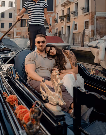 A couple relaxes on a gondola during a romantic trip for two planned on Pilot. 