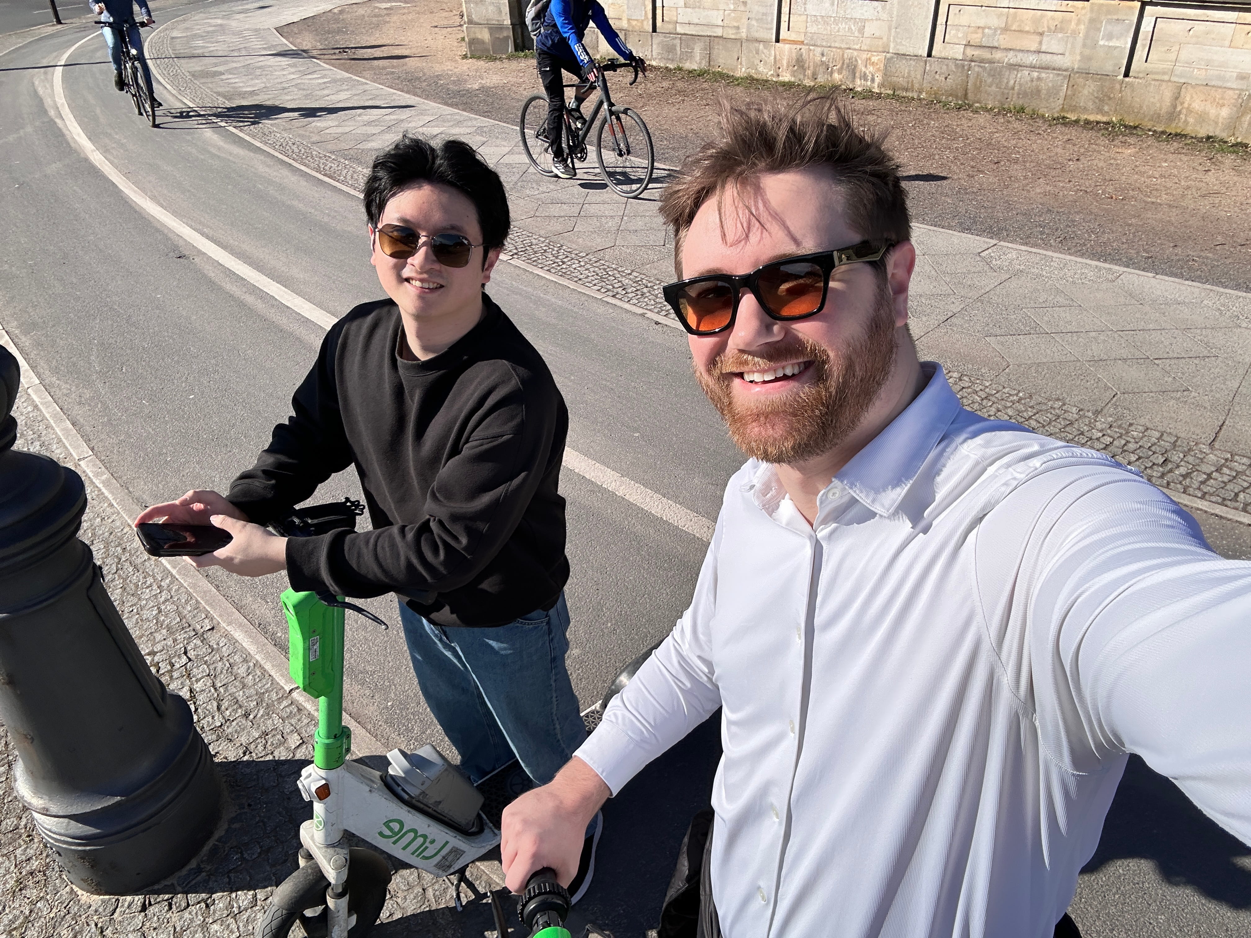 Teammates on scooters in Berlin