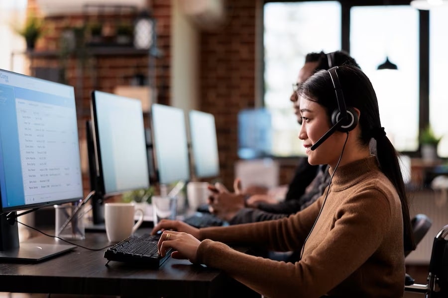 Employees working at call center reception