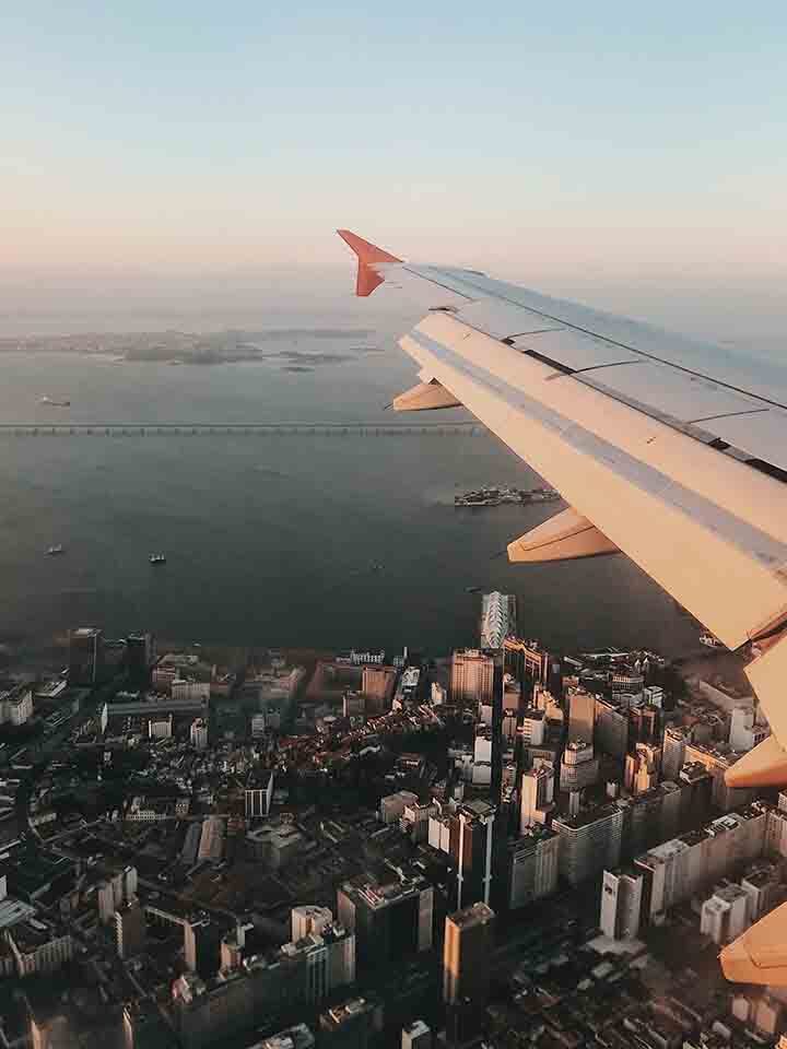 Airplane flying above a city.