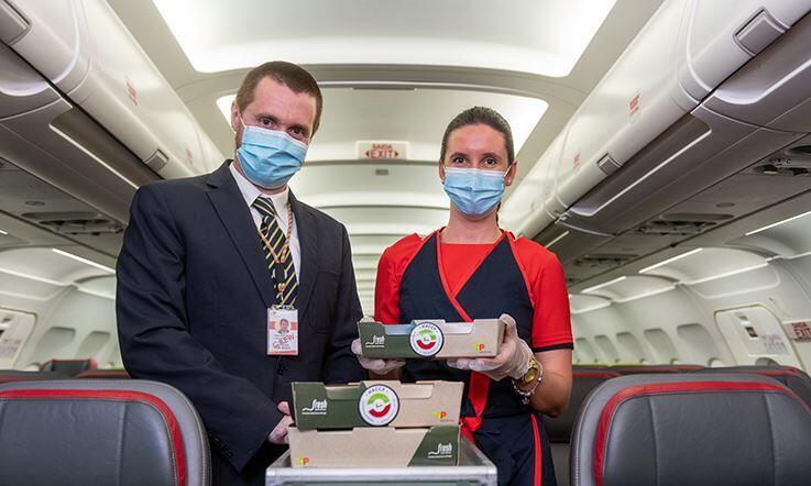 TAP Air Portugal air attendants offering me food