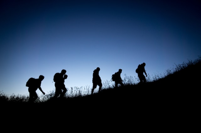 Hikers using hiking apps while hiking