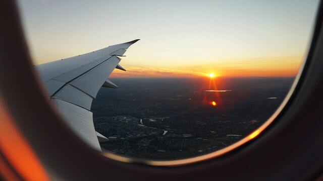 Looking out of airplane window on secret escapes vacation