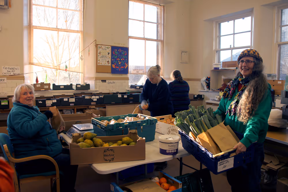 Galloway Food Hub volunteers prepare customer orders on a sunny afternoon. Photo: Bethan Phillips