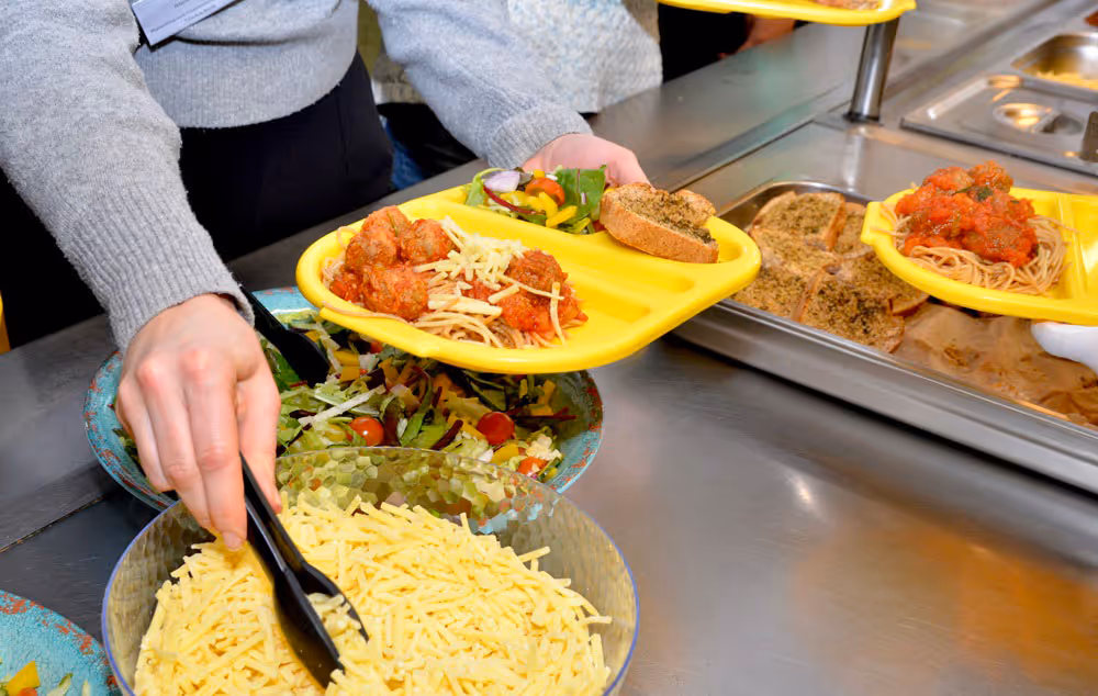 Special spaghetti Bolognese school meal served on trays at St Ebbe’s Primary school in Oxford