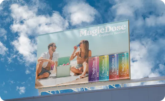 Magic Dose billboard against a cloudy sky showing friends with the full can lineup