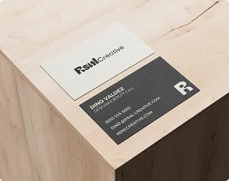 RSNL Creative business cards on a wooden desk
