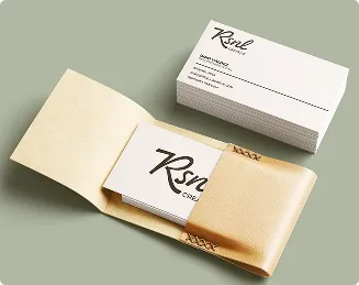 RSNL Creative business cards in a kraft paper sleeve