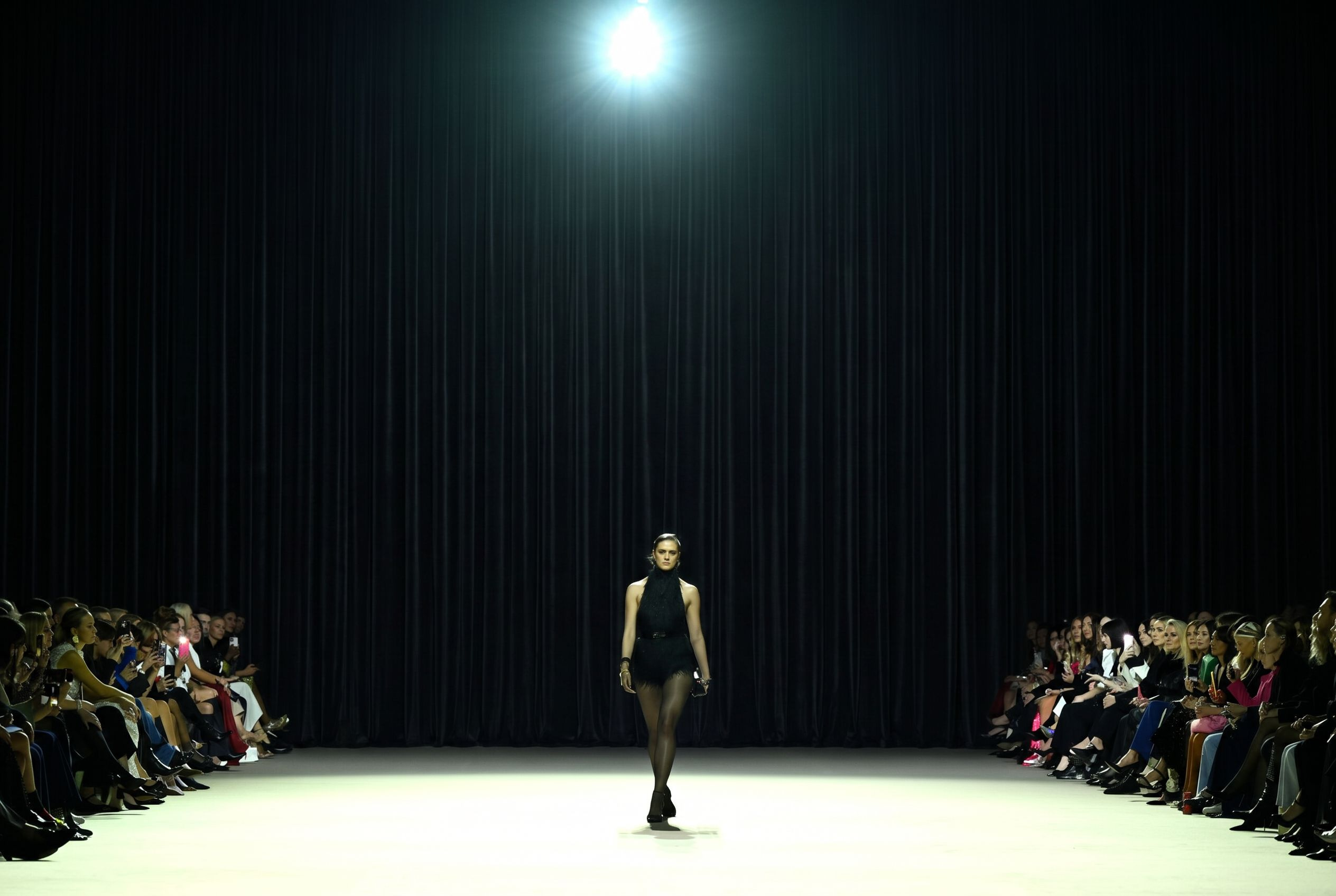 Black velvet backdrop draping pre-rigged on tracks for runway shows at Australian Fashion Week, Carriageworks Sydney