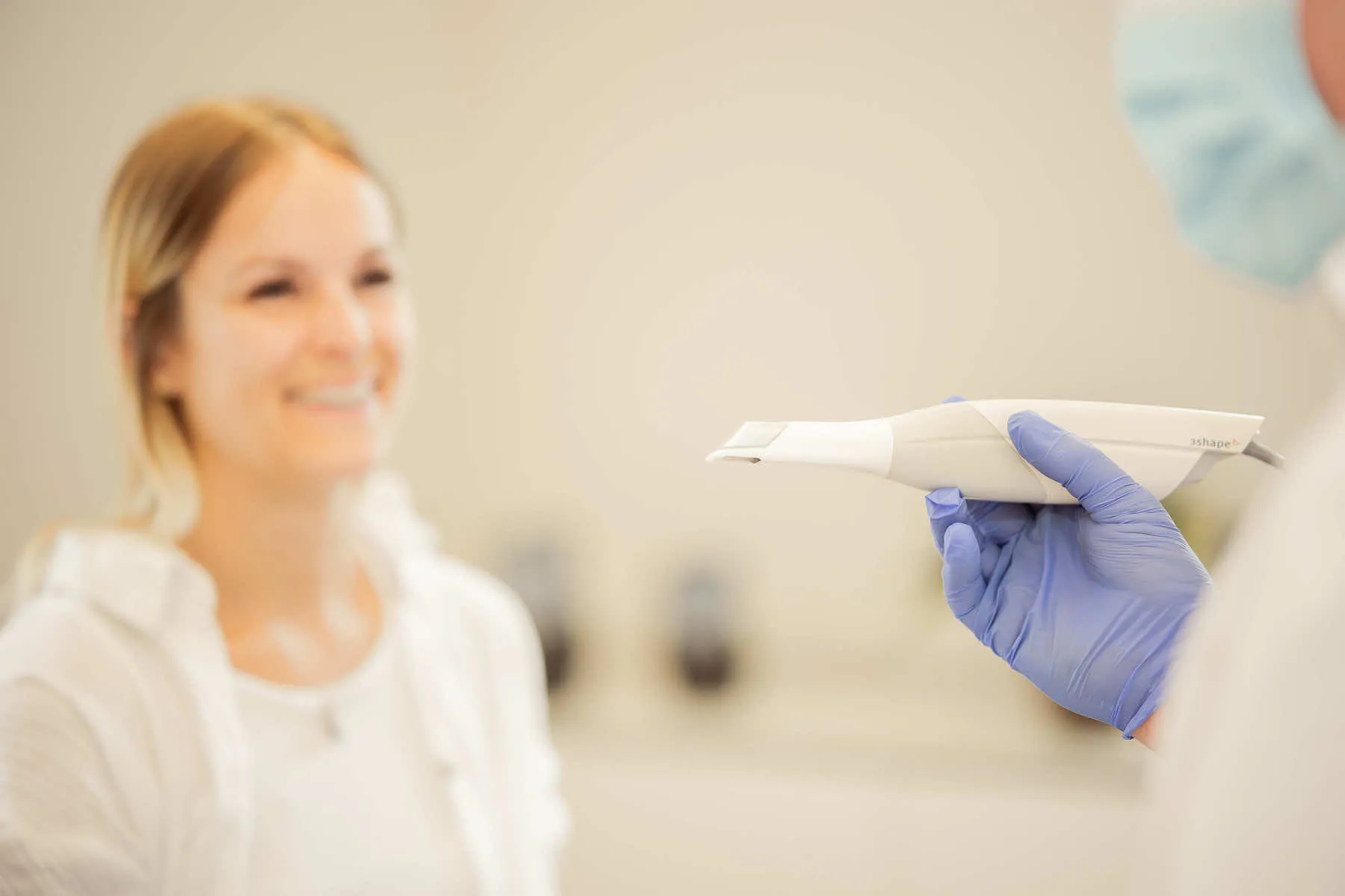 a woman in a white shirt is holding a white object