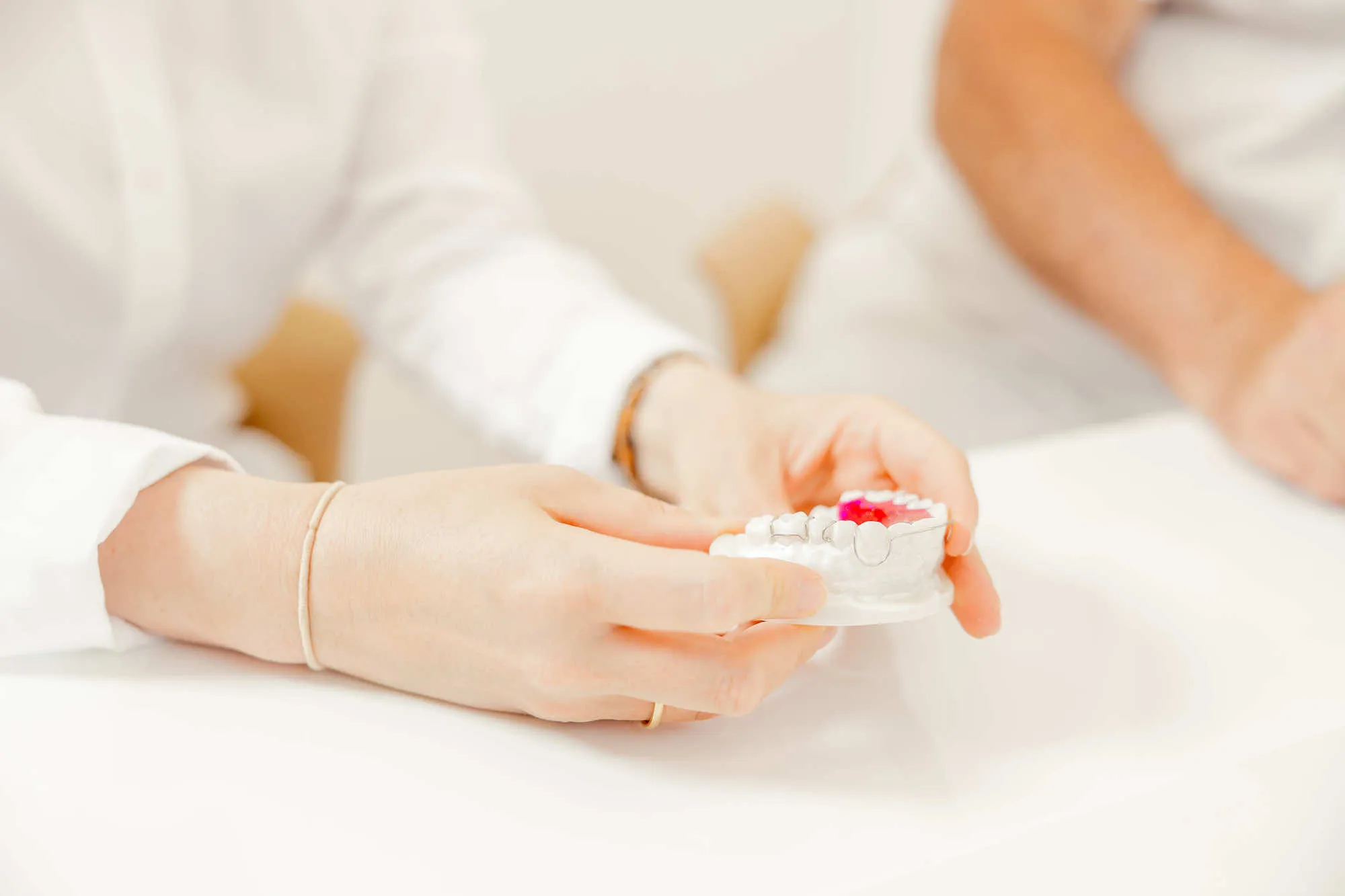 a person holding a toothbrush in their hand