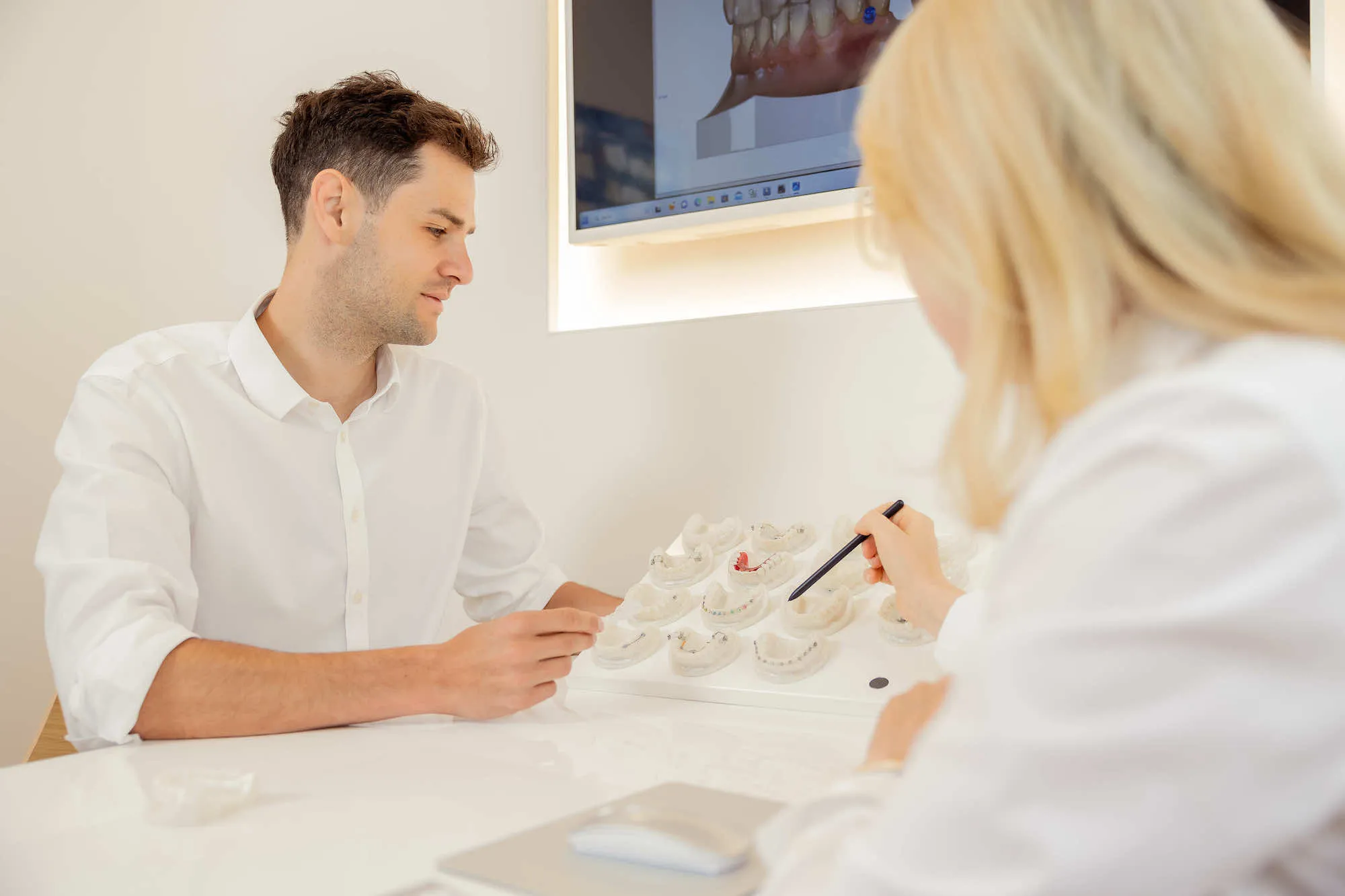 a man sitting at a table with a woman