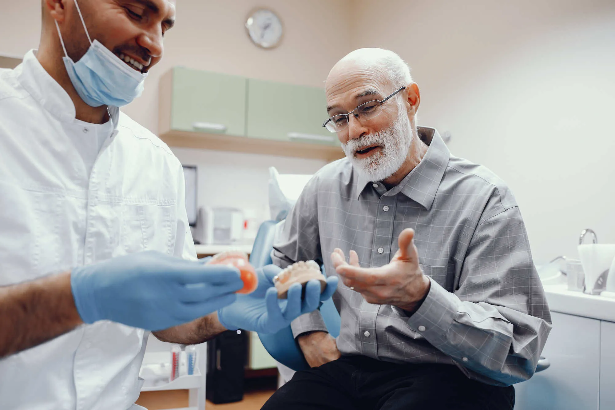 a man getting a dental check up from a dentist