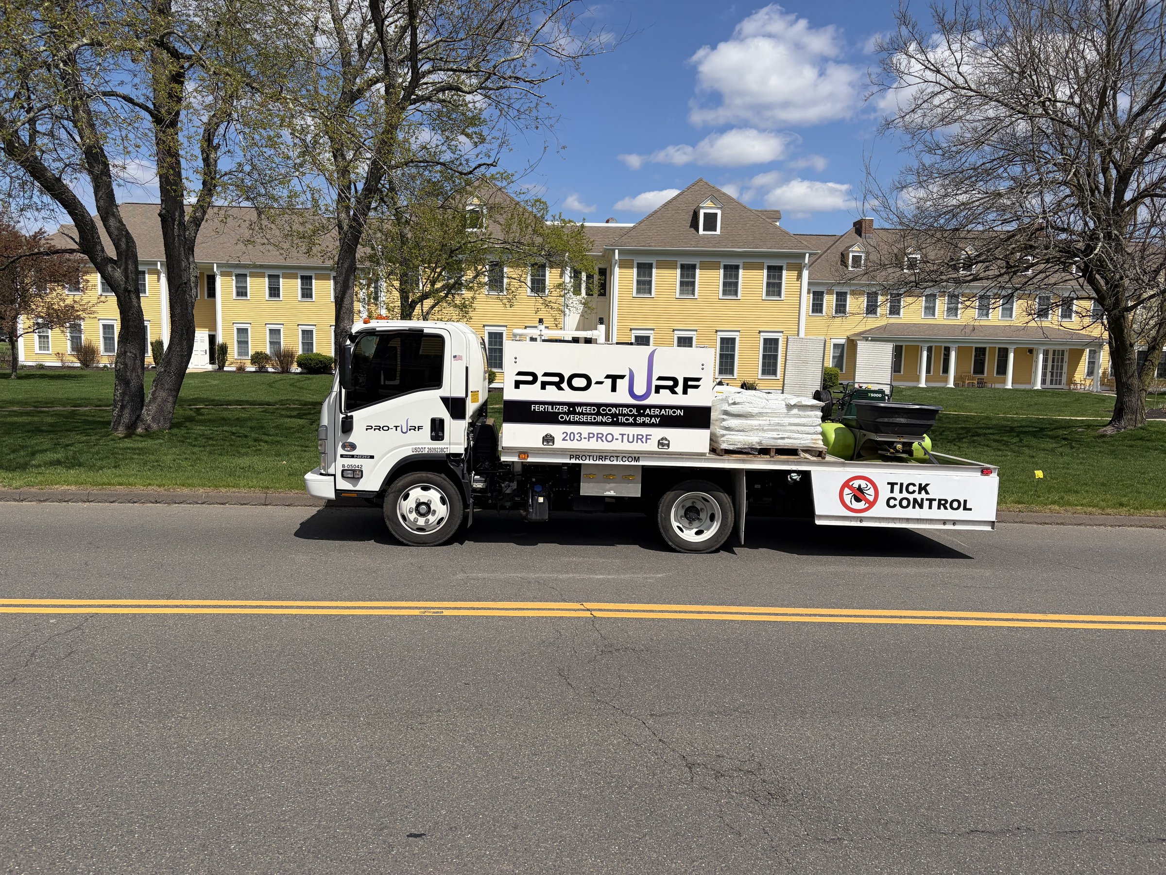 Pro Turf fertilization truck and spreader on a Connecticut property