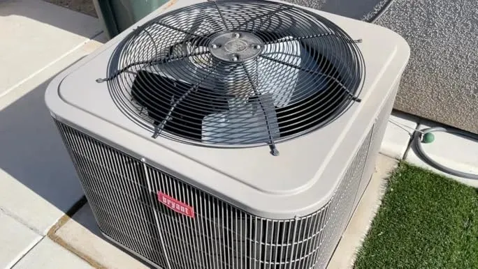 bryant brand outdoor AC unit placed outside of the house