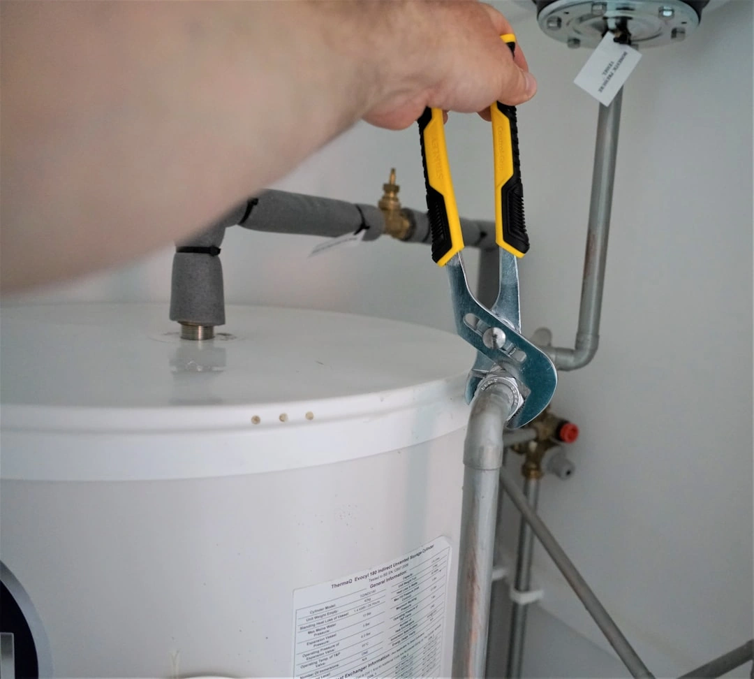 Energy-efficient heat pump water heater in a modern garage setting - efficiency ratings explained for homeowners Energy-efficient heat pump water heater in a modern garage setting - efficiency ratings explained for homeowners