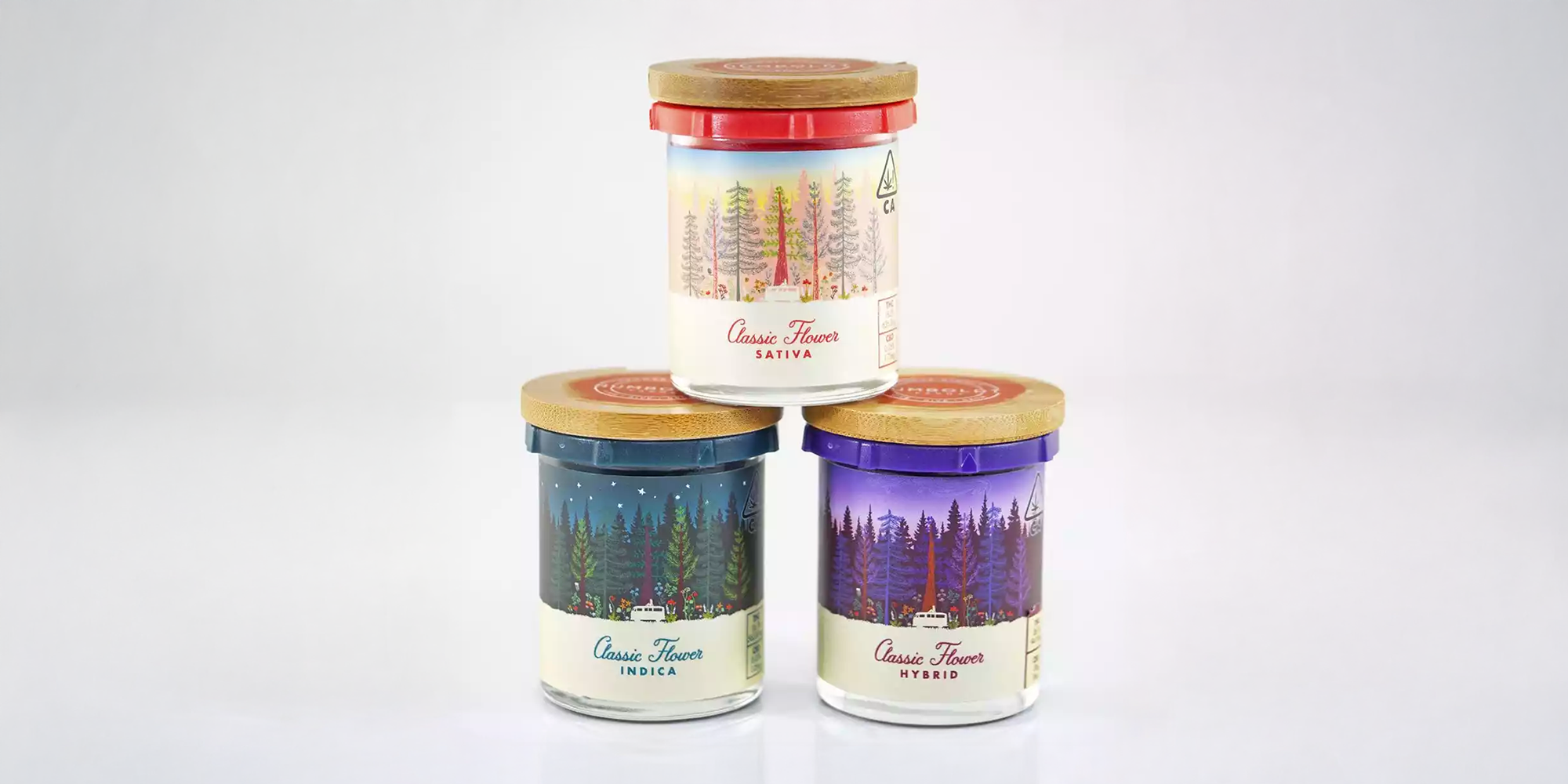 This is an image of three different types of containers containing loose marijuana flower from Humboldt Farms. The color of the containers is different, depending on the varietal it contains. The red package contains Sativa, the dark green one contains Indica, and the purple one contains a hybrid variety. The three containers, which are jar-looking, are stacked like a pyramid. 