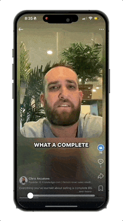 A cell phone with a man's face on the screen.