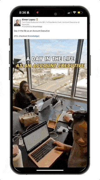 A cell phone with a picture of two people sitting at a table.