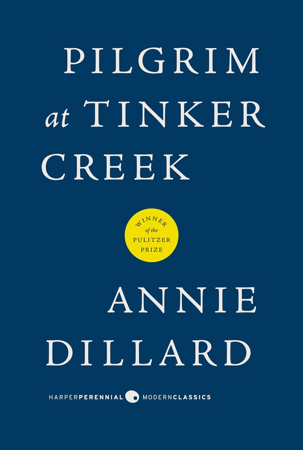 Book Cover for "Pilgrim at Tinker Creek". It has a dark blue background and white text with a yellow Pulitzer prize sticker in the middle.