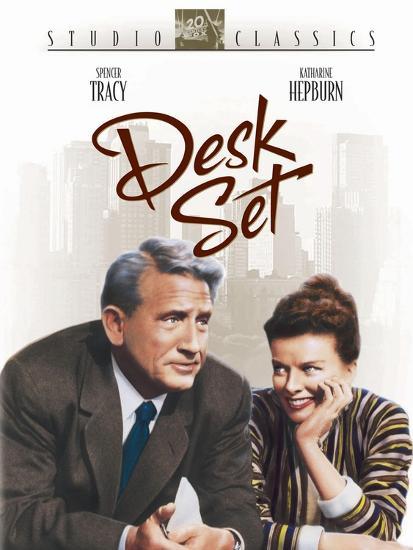Movie poster for "Desk Set" featuring illustrated renderings of Spencer Tracy and Katharine Hepburn. They look spooky as hell, definitely something ghoulish in those eyes.  