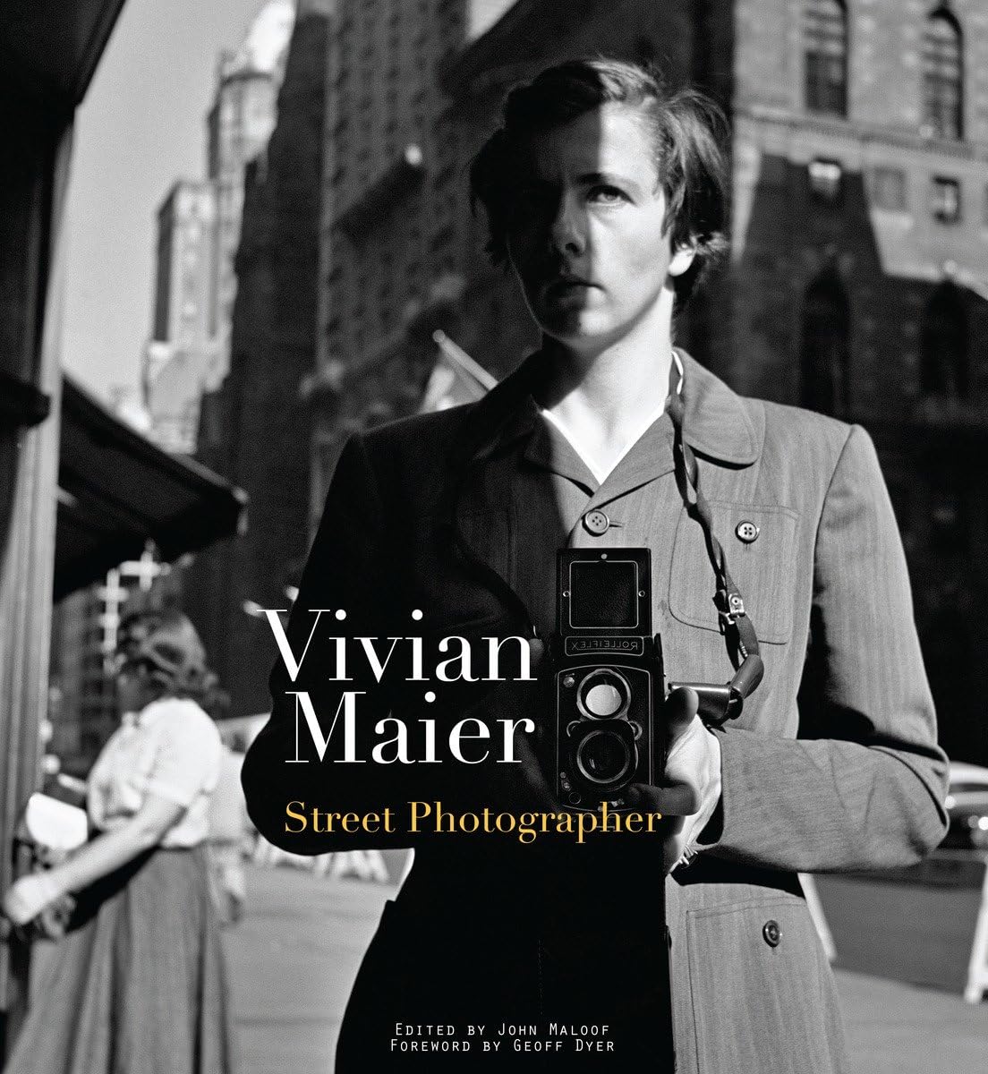 Book cover of "Viviane Maier, Street Photographer" featuring a large black and white picture of the photographer herself, holding a camera on a street.