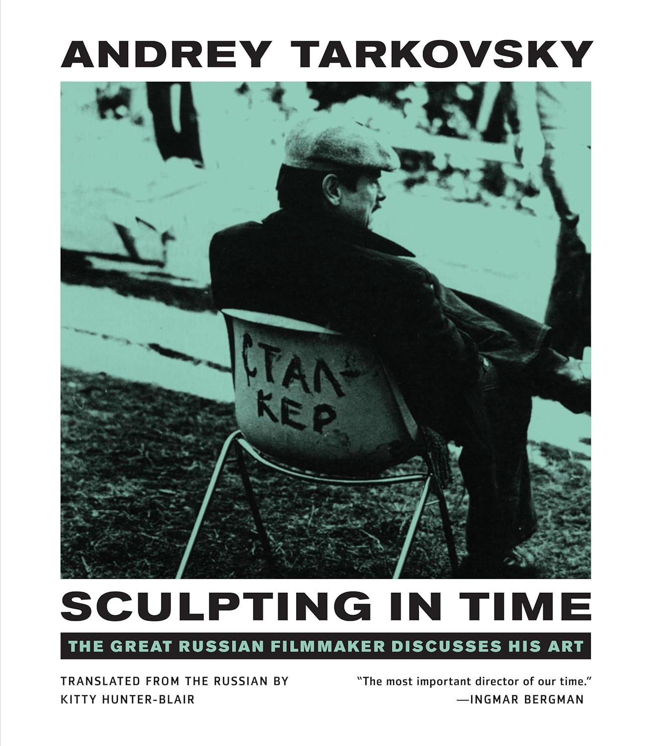 Book cover of "Sculpting in Time" featuring a duotone turquoise/black image of Andrey Tarkovsky in a director's chair.