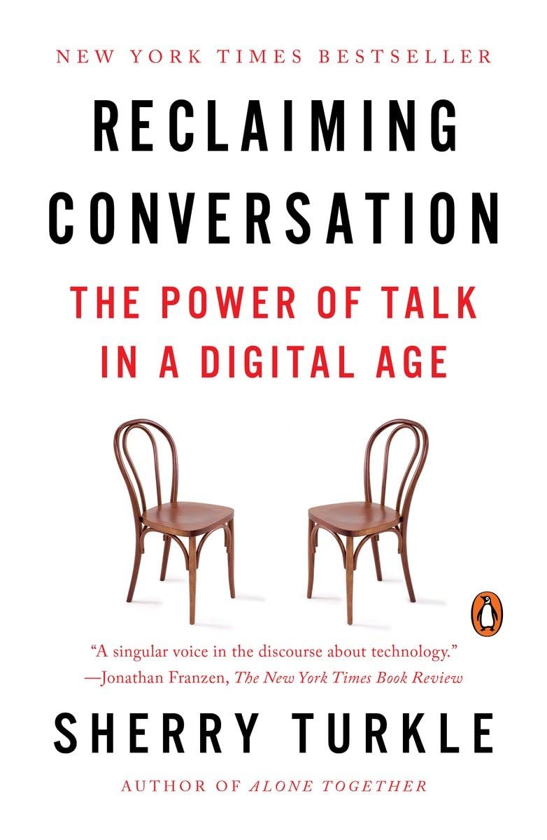 Book cover for "Reclaiming Conversation: The Power of Talk in the Digital Age". There's a white background and two empty chairs facing each other. 