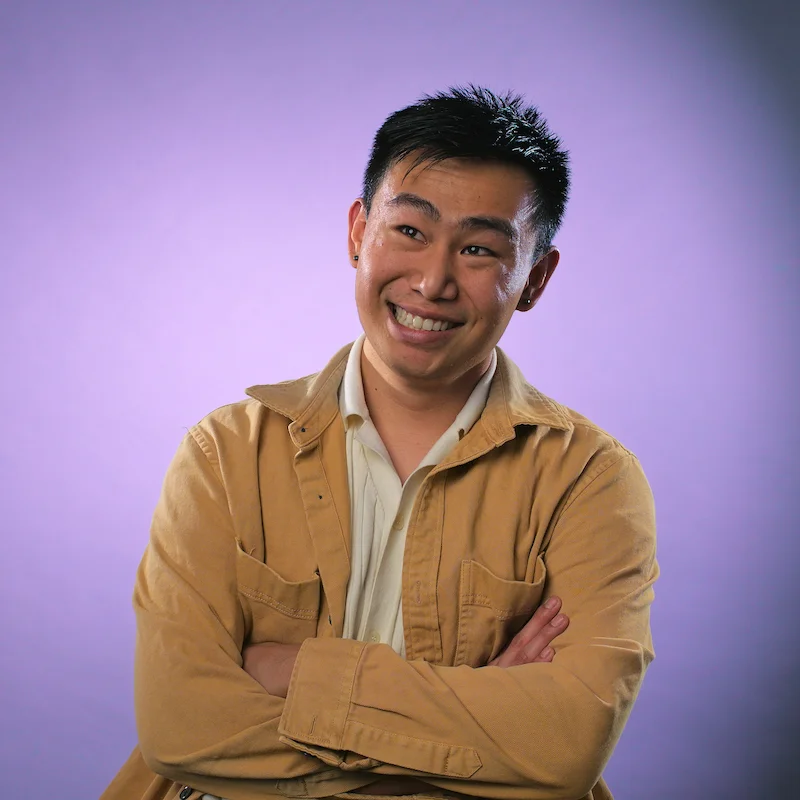 Purple Headshot of Ryan Fann