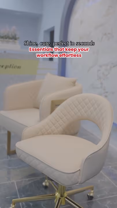 Two modern beige office chairs with gold legs on a tiled floor, with motivational text above reading 'Shine, cure, perfect in seconds. Essentials that keep your workflow effortless.'