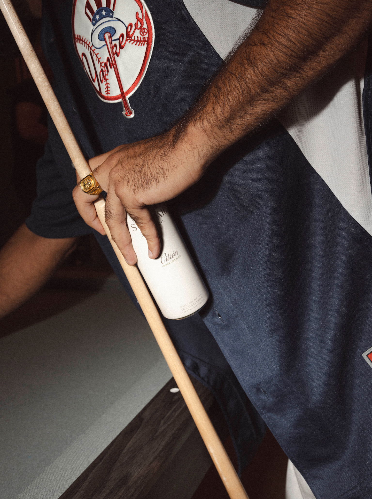 Box of Suntail Drink Co. Citron lemon lime margarita cocktail placed on a glossy red surface.