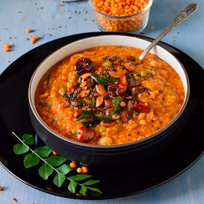 Delicious, hearty and healthy meal of rice, lentils and vegetables that is tempered with spices and nuts.