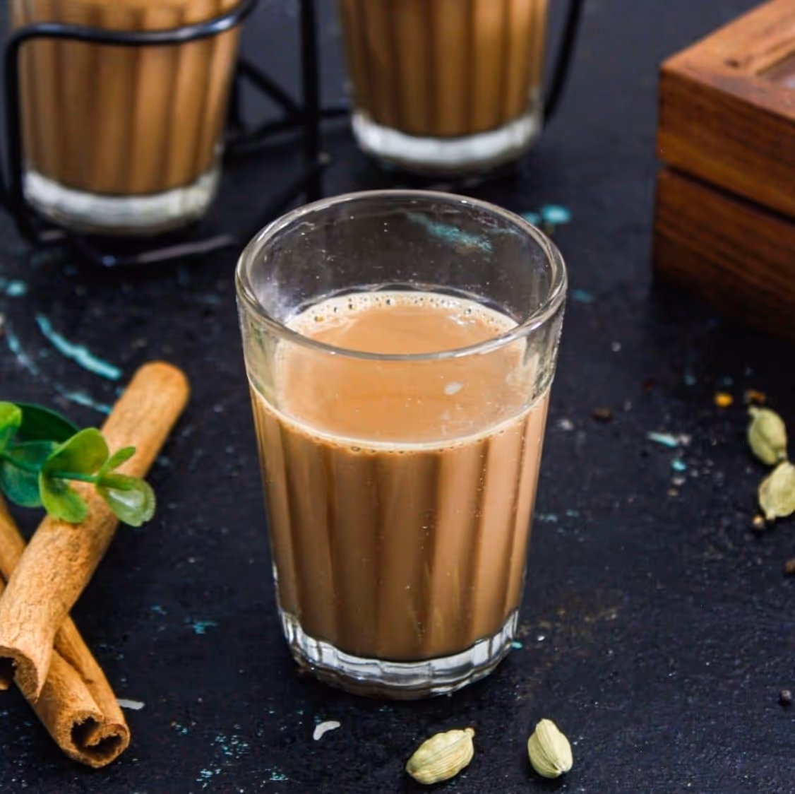 Indian beverage made by brewing black tea with fragrant spices, sugar and milk.