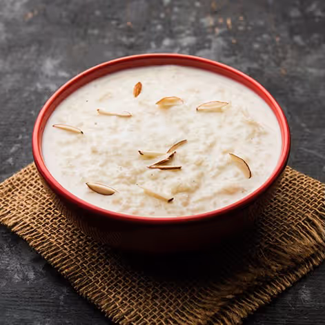 Kheer, also called Payasam, is a rice pudding made from slow-cooked rice, milk, sugar and flavoured with saffron, cardamom, raisins.
