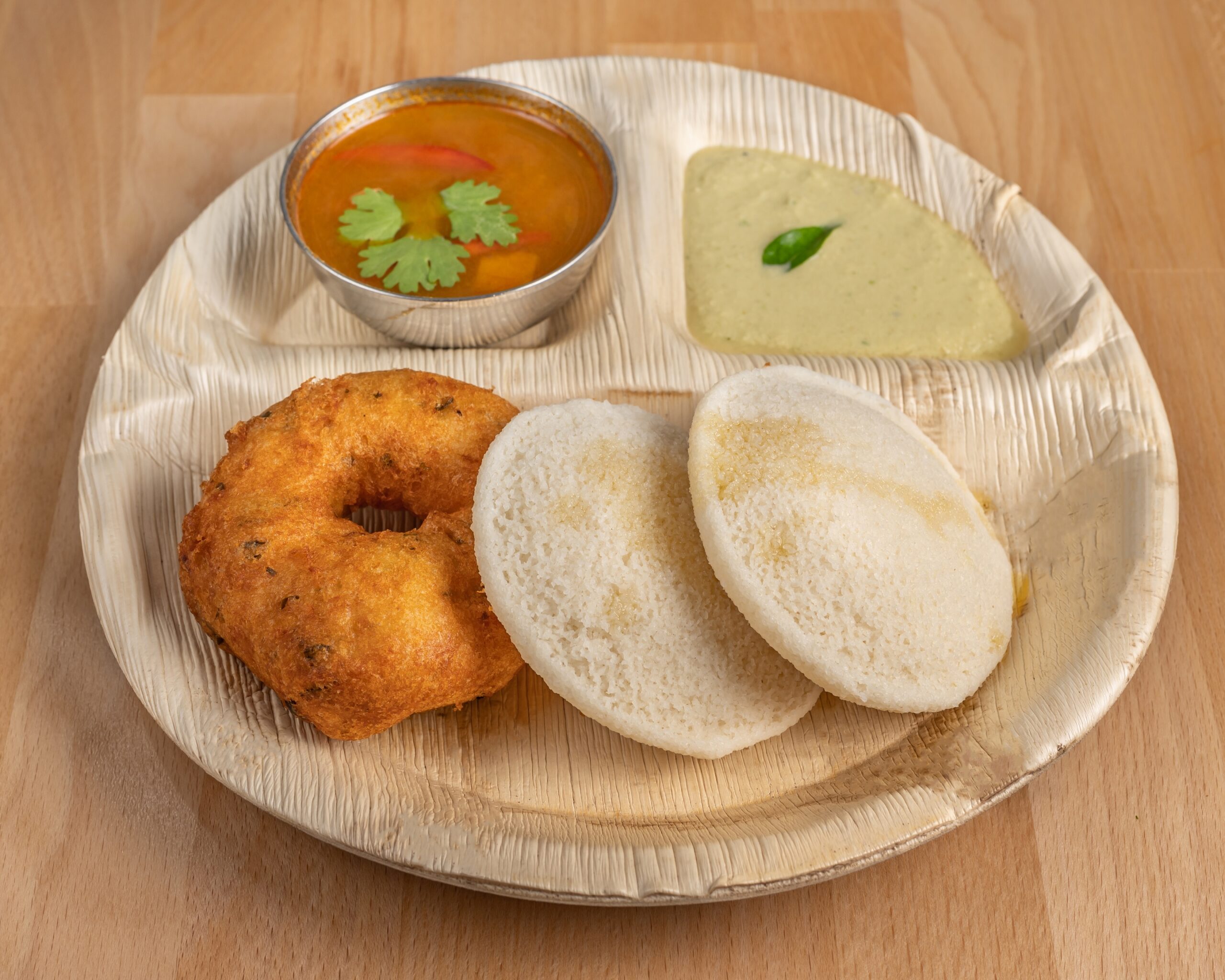 2 Idlies and 1 Vada, served with Chutney & Sambar.