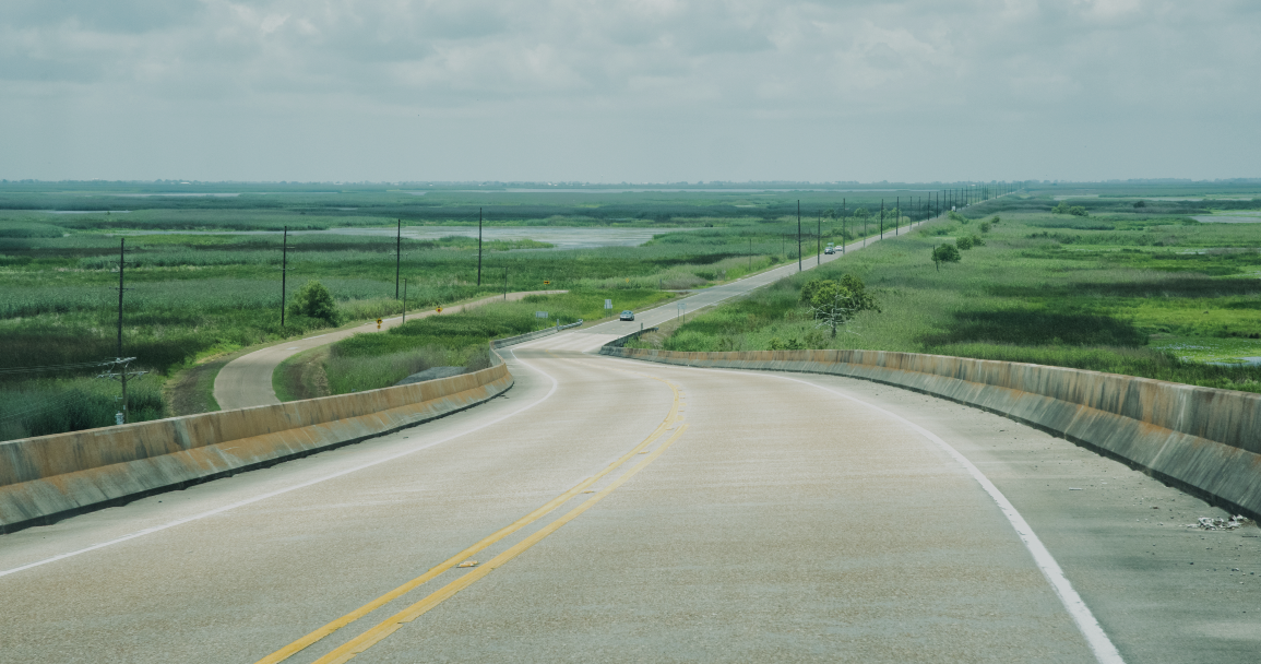 Winding Louisiana Highway Through Open Wetlands